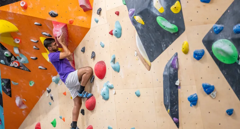 Student on climbing wall