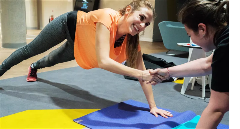 female student on yoga mat