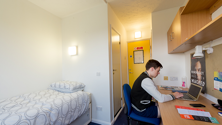 Great Dover Street Bedroom with student working at desk