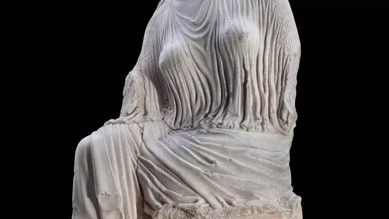 image of a marble statue depicting a woman's body