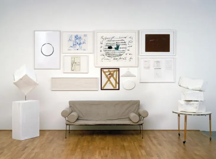 Image from the Tate Modern workshop of Franz West featuring a sofa and a wall of posters.