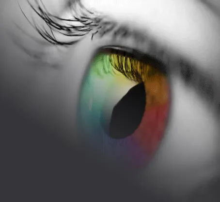 Black & White image of an eye that has been edited to display the iris of the eye in multicolours 