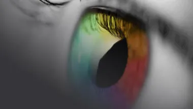 Black & White image of an eye that has been edited to display the iris of the eye in multicolours