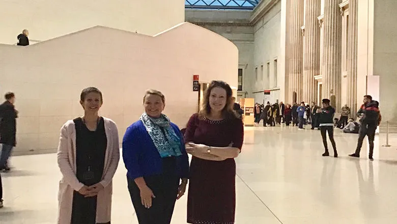 Three women stand in the atrium at the British Museum