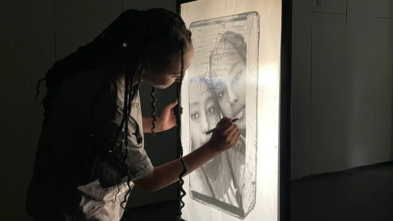 Tracing over personal images enlarged by an analogue projector at the National Portrait Gallery.