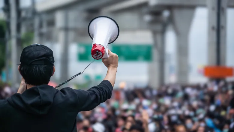 person with megaphone 780x440 (shutterstock)