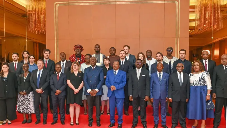 The report authors presenting the report to the President of Cameroon, Paul Biya.