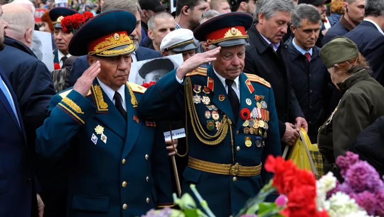 Veterans walking with flowers during the celebration of Victory Day in Ukraine 