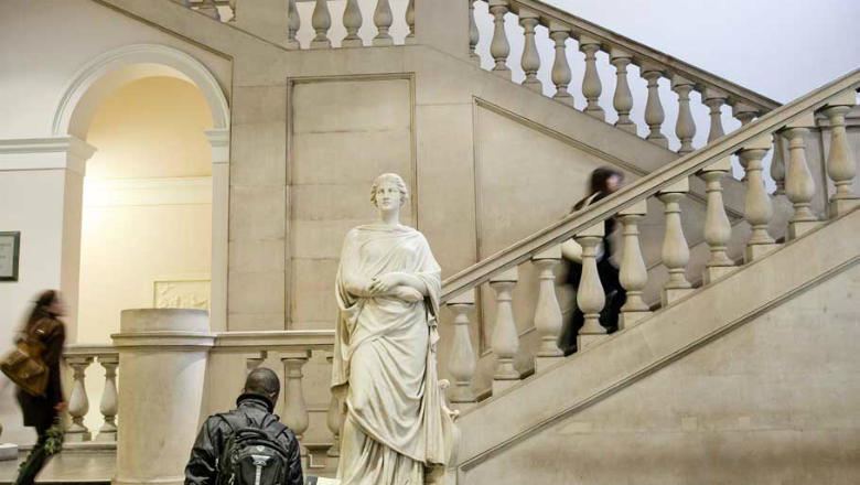 Image of the main stairway in the King's Building, with female classical statue