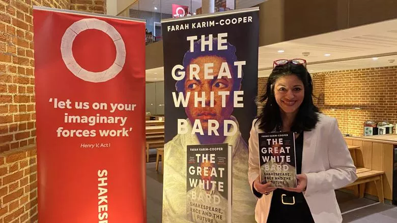 The photo shows Professor Farah Karim-Cooper holding her book The Great White Bard at Shakespeare's Globe