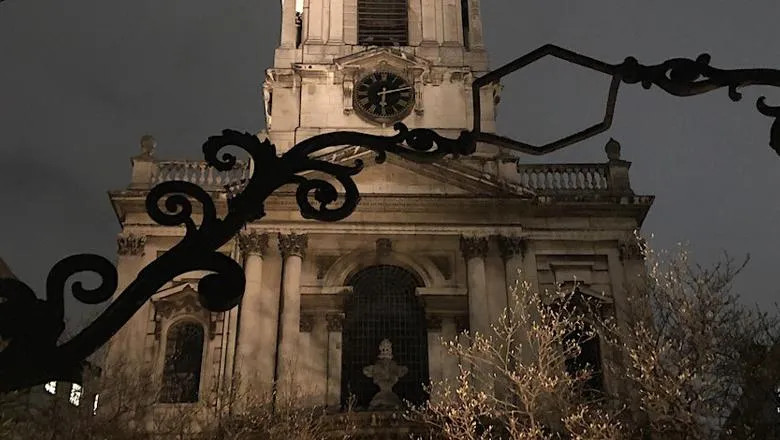 The image shows St Mary le Strand church at night.