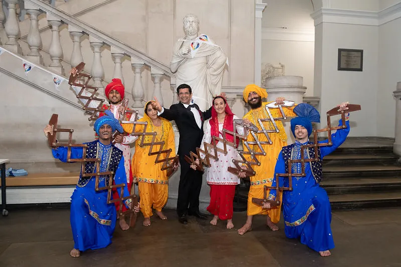 Bhangra dancers in coustume with Professor Shitij Kapur