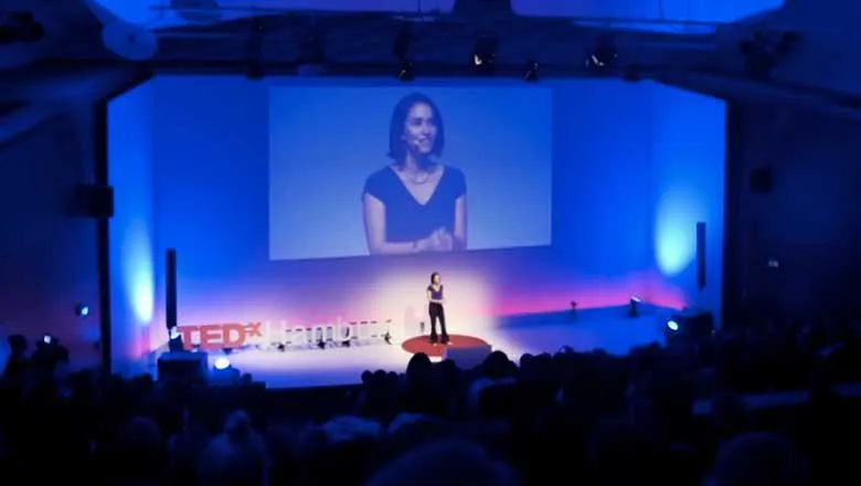 Jessica on stage giving her TEDx talk