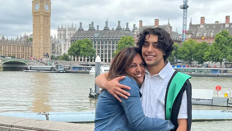 Ali and Sadi stand hugging in front of Big Ben