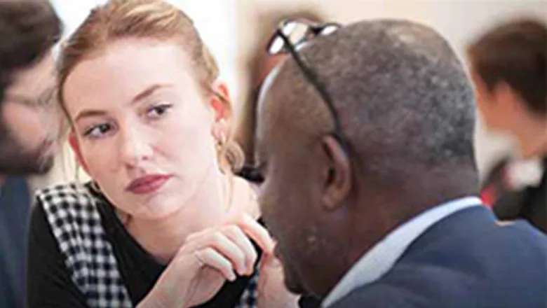 A student talks to a mentor
