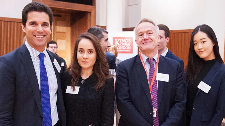 David Martinelli pictured with King's Business School staff and the interns he mentors