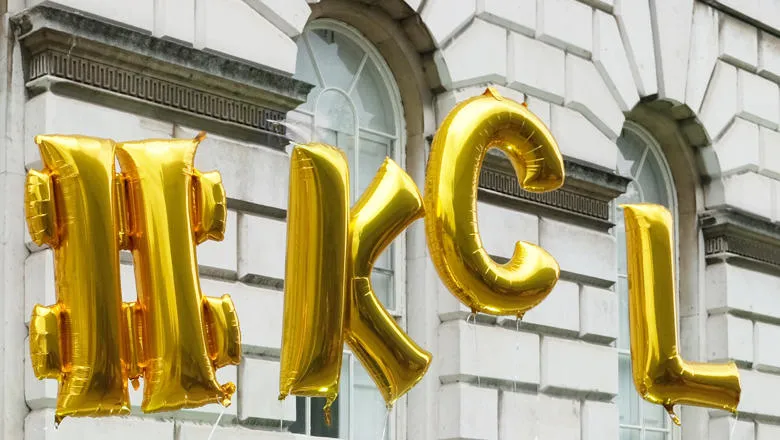 Gold helium balloons spell oout #KCL