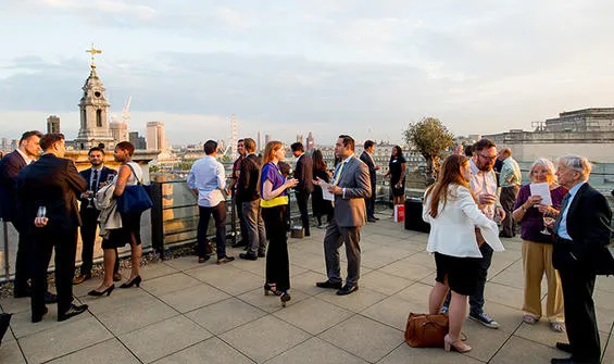 Friends and family celebrating on the terrace of Bush House
at the King's Distinguished Alumni Awards 2018