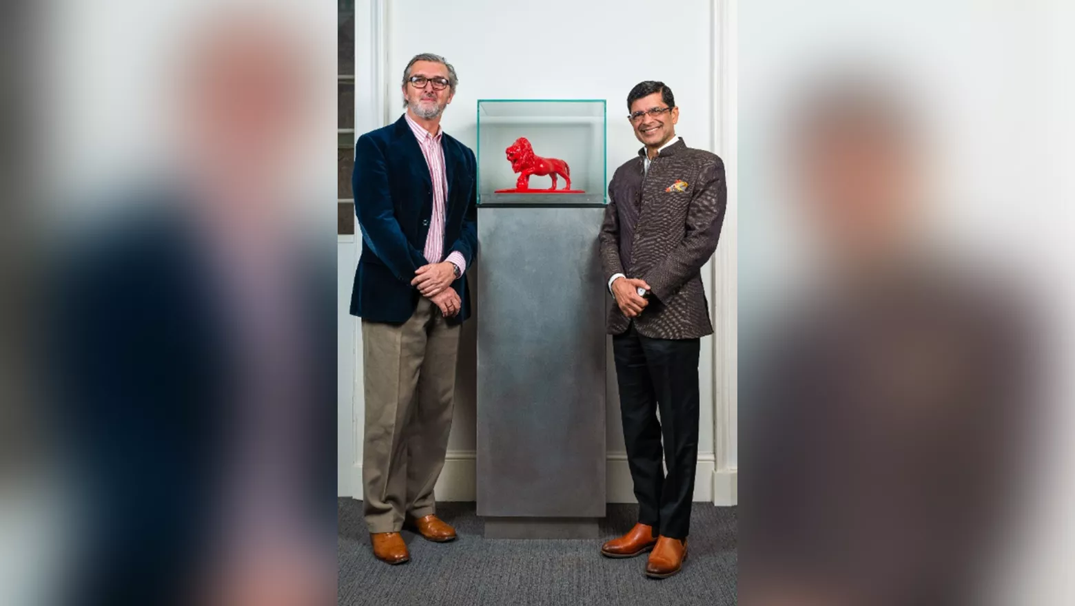 Professor Dan Hunter and President & Principal, Professor Shitij Kapur  pictured standing beside the bronze Reggie statue which sits in 'Willie’s Common Room for Law Students'