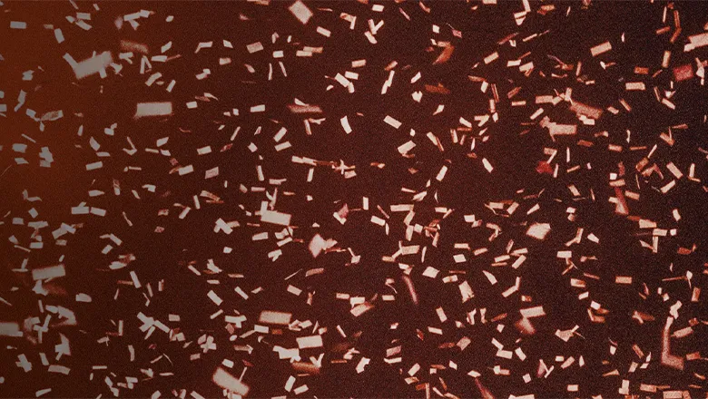 Falling confetti on a red background