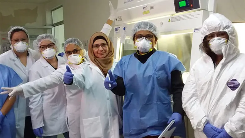 Five medical staff in PPE equipment.