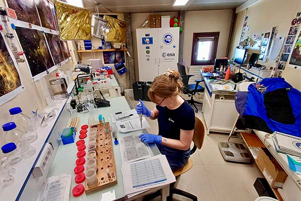 Nina conducting grey water treatment unit testing in the Concordia Station laboratory