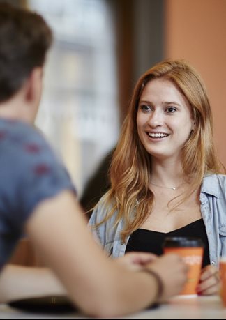 image of student in a cafe