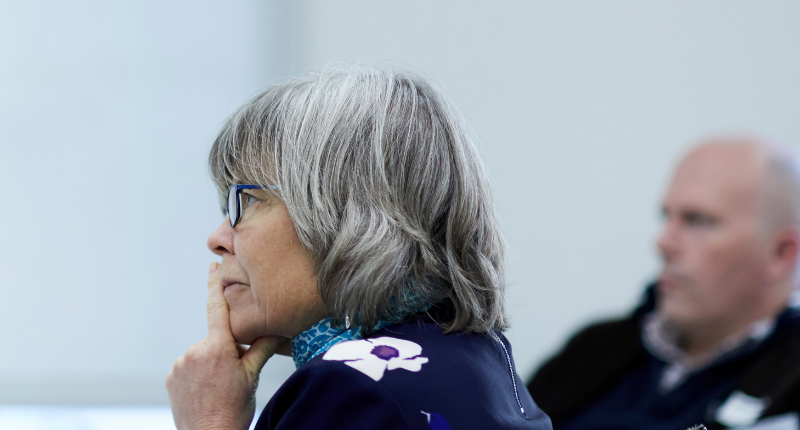 senior lady thinking at event conference