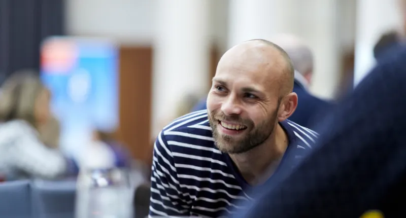 staff male smiling at event