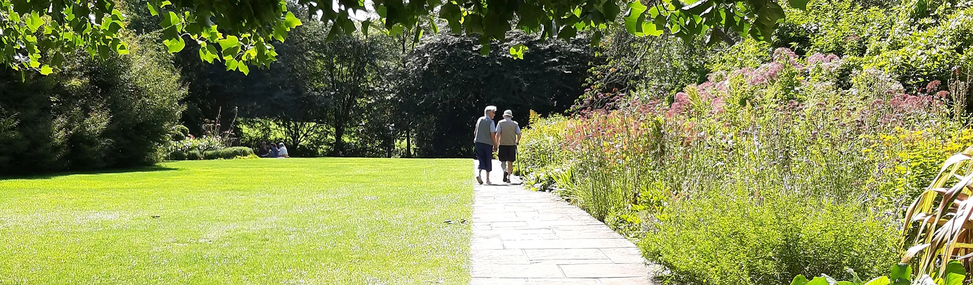 elderly couple walking in garden hero csi 1903x558