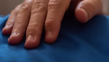 hand on stomach close up midnight blue csi 1903x558