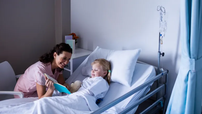 nurse reading to child girl patient  780x450