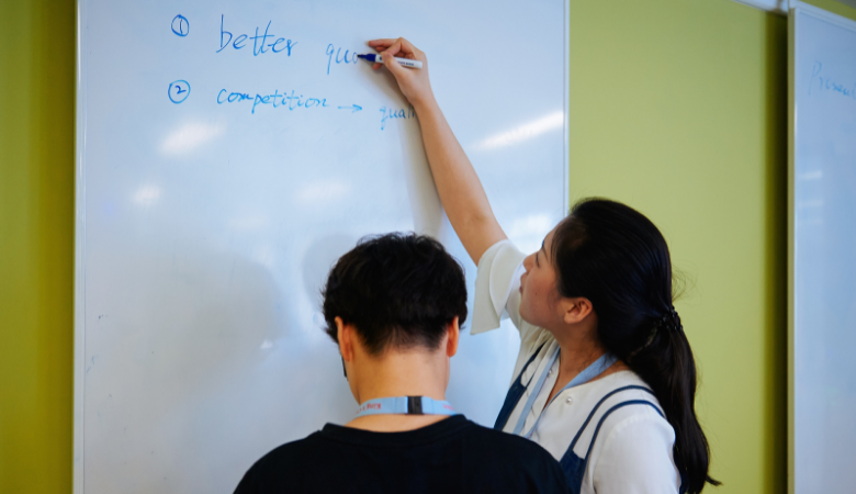 students working on whiteboard