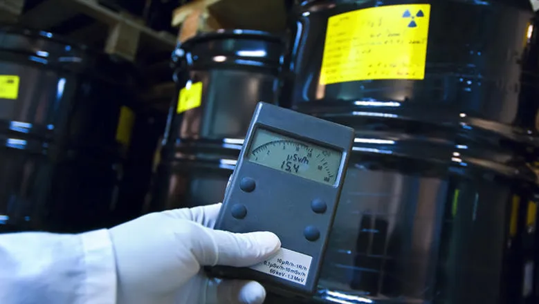 Man checking radiation with Geiger counter
