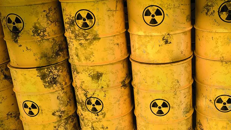 yellow radioactive waste barrels