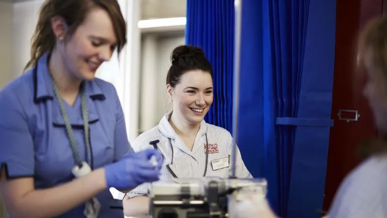 A nurse speaks with a patient.