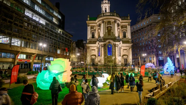 Strand Aldwych at night time with colourful giant robot creatures