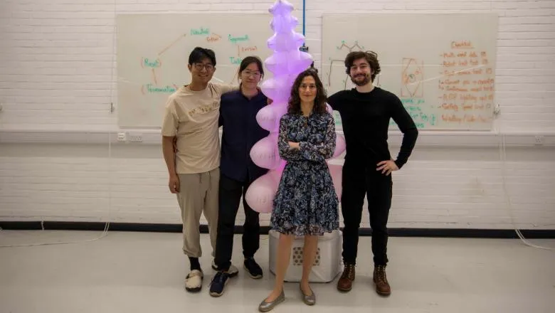 Dr Oya Celiktutan (centre) with King’s students Jeffrey Chong, Theodore Lamarche and Bowen Liu and Sprout the robot