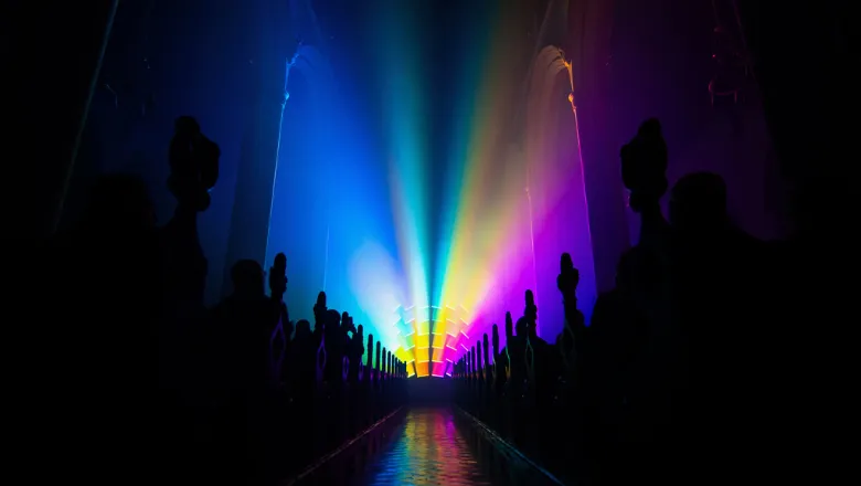 A Church with multicoloured lights shining through it