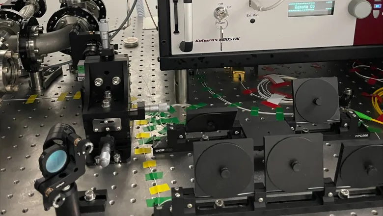 Image of tape lining the breadboard where the physics equipment is assembled