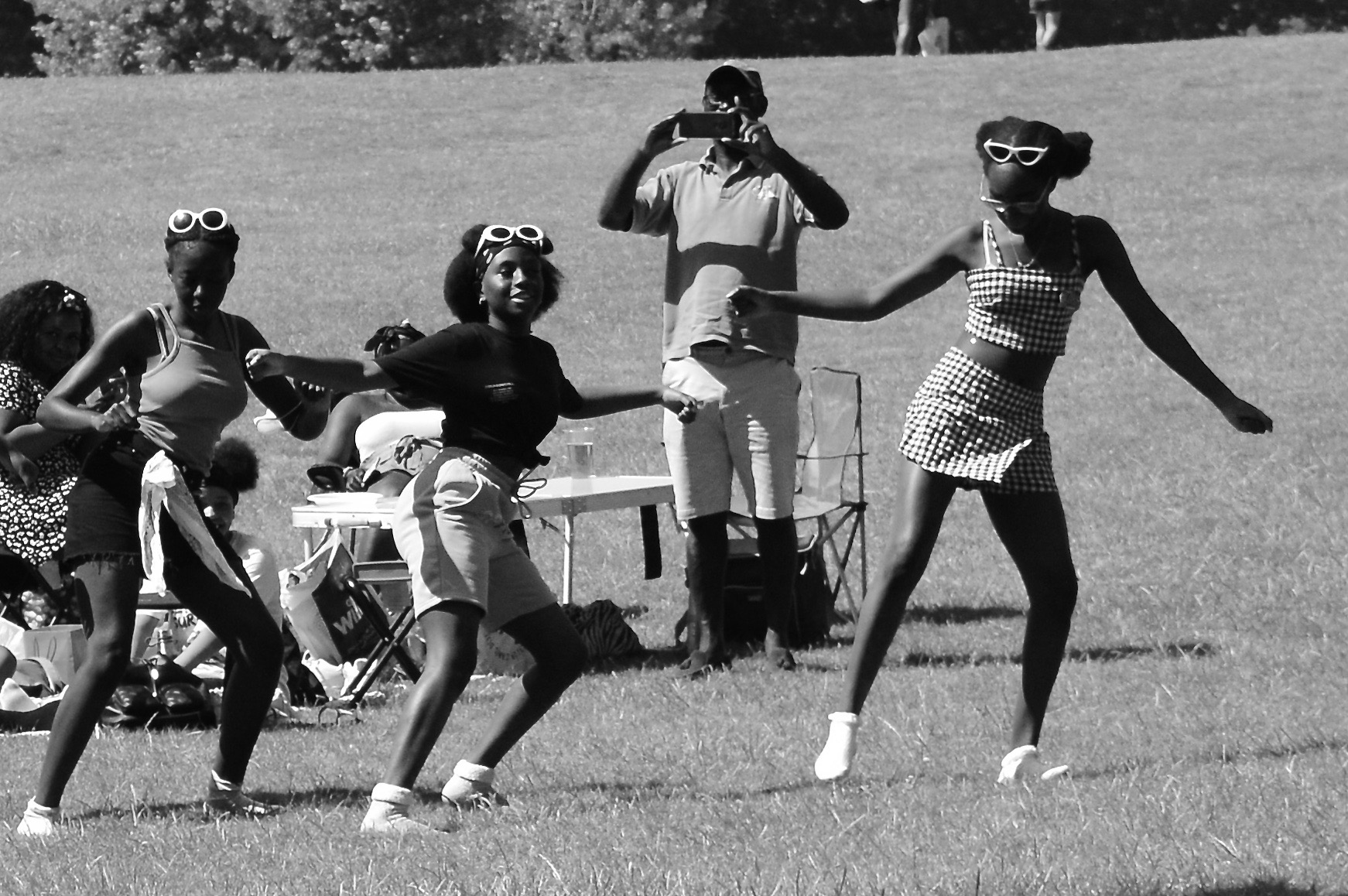 young girls dancing in the park