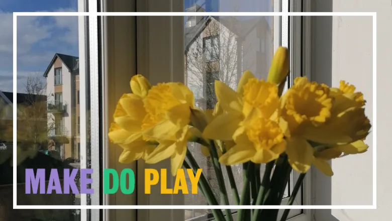 Image of flowers in a window with an overlay of Make Do Play