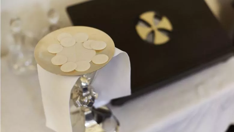 Communion wafers and silver chalice