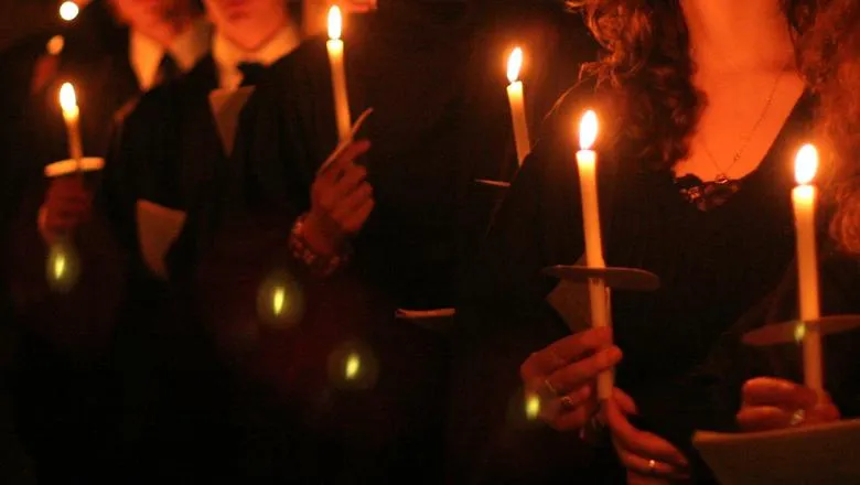 Choral Scholars holding candles