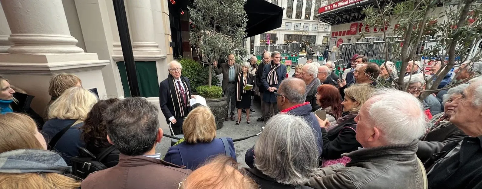 Over 70 people gather to see the unveiling of the plaque.