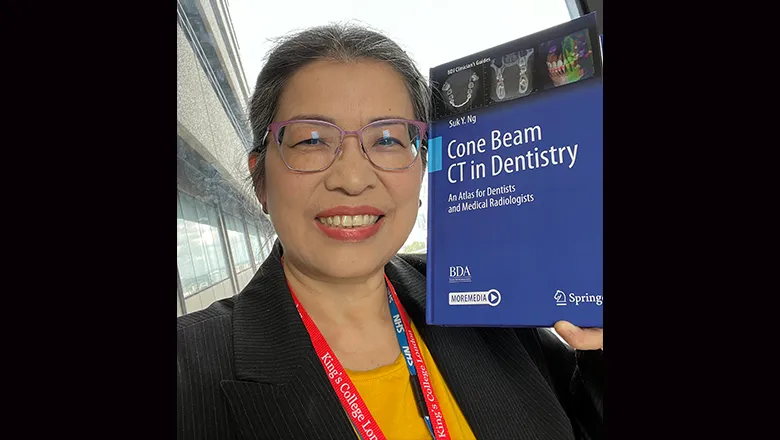 Dr Suk Ng with her book Cone Beam CT in Dentistry: An Atlas for Dentists and Medical Radiologists