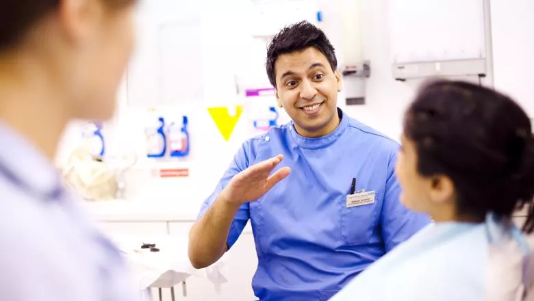 Dentist discussing treatment with patient