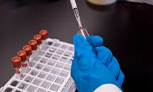 Scientist with test tubes