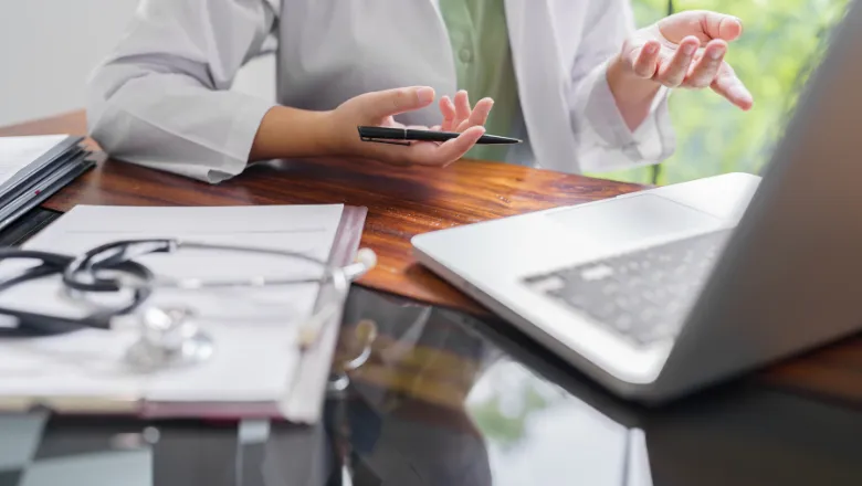 Doctor working at a laptop