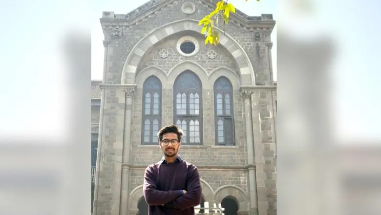 An image of Rushikesh Mhaisne stood in front of a building